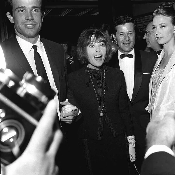 Warren Beatty actor and actress Leslie Caron June 1965 arrive for the premiere of