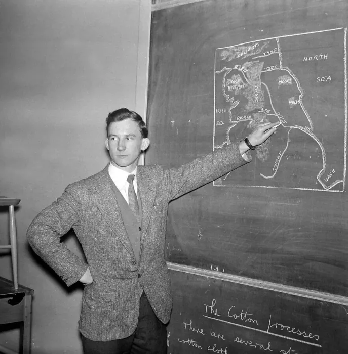Framed Print : Warren Bradley of Manchester United writing on the chalk board in the classroom
