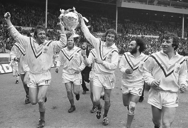 Warrington RLC seen here celebrating winning the Rugby League Cup by completing a victory