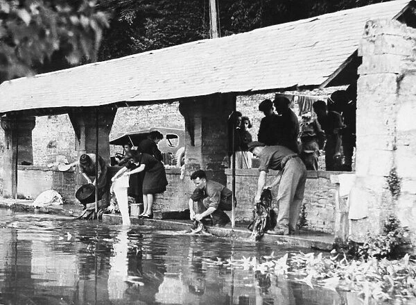 Washing day in Cruelly where French civilians and British tommies do their washing side