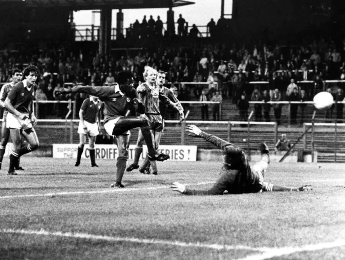 Framed Print : ) watches as Dave Bennett scores against Hereford goalkeeper John Jackson. Aug 1982