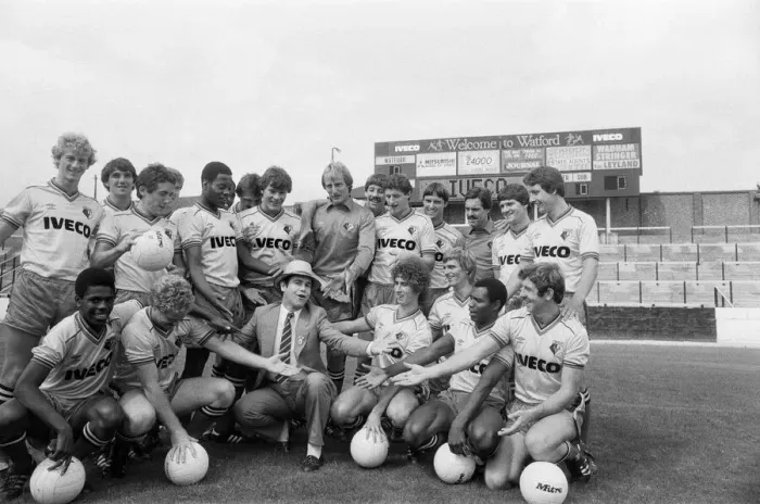 Framed Print : Watford FC chairman Elton John with Watford football team at a photocall Framed Print : Watford FC chairman Elton John with Watford football team at a photocall