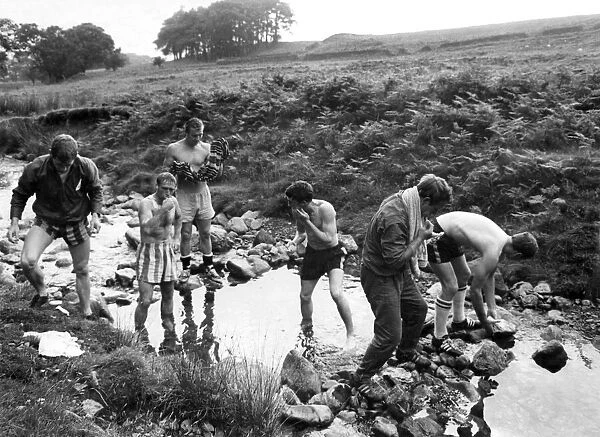 Watford in training in the Lake District. Some of the team bathing in a stream near