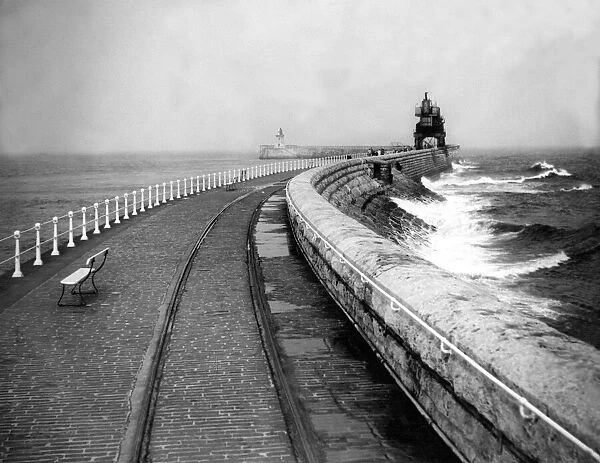 Waves lash the pier at South Shields 19 August 1958