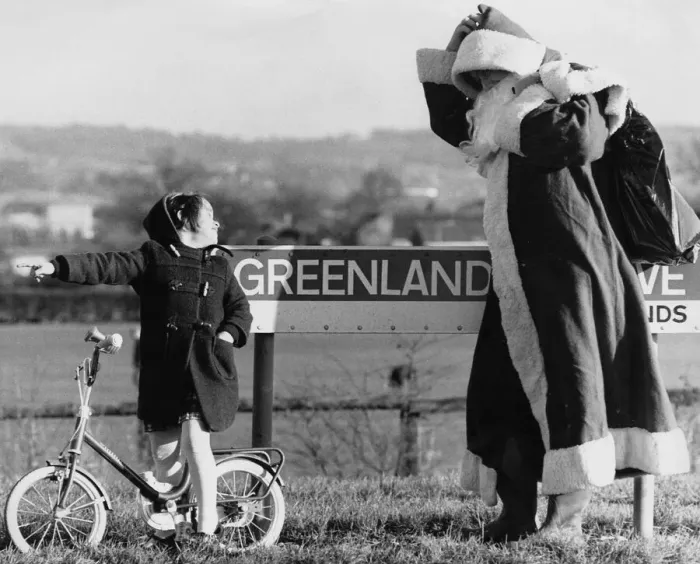 Framed Print : That way, Santa, says toddler Laura Tyrell, aged 4, to Father Christmas after he got Framed Print : That way, Santa, says toddler Laura Tyrell, aged 4, to Father Christmas after he got