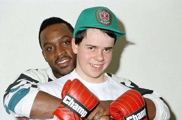 Former WBO middleweight champion Nigel Benn with boxer Richard Ross. 6th March 1990
