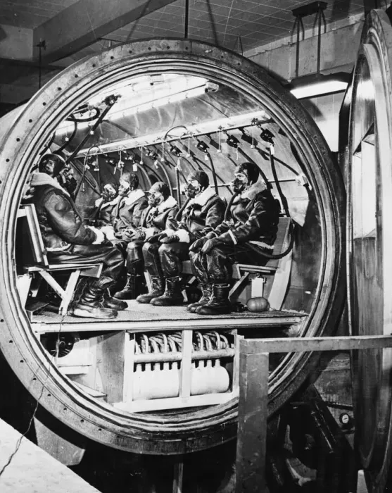 Framed Print : Wearing oxygen masks and cold-weather flying gear these men are shown in the cold-weather