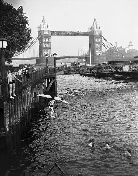 Weather Hot London Tower Bridge June 1952, Boys jumping off the bank of the River Thames