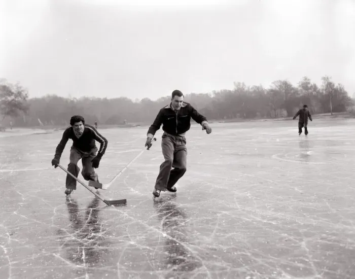 Framed Print : Weather Winter Scenes 1954 Two boys playing ice hockey on a frozen lake in winter