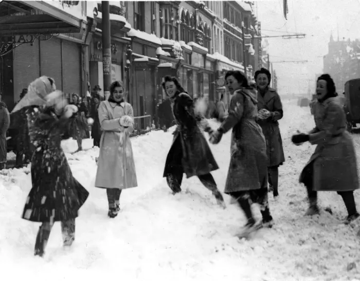 Framed Print : Weather - Some young shop girls enjoy snowballing during a heavy snowstorm in St Mary
