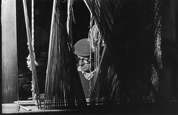 A weaver operating a loom at the Royal Weaving Company in Belfast. Circa 1966