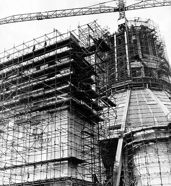 In a web of steel scaffolding, the main entrance to the Liverpool Metropolitan Cathedral