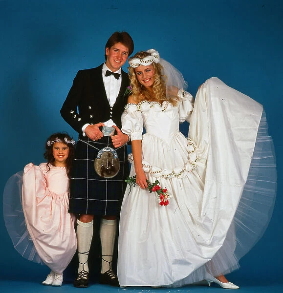Wedding dress fashion, February 1987 Model wearing wedding dress with groom wearing