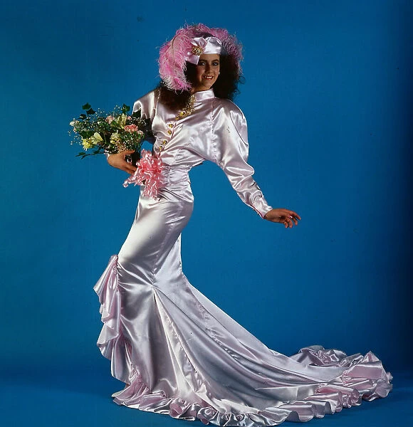 Wedding dress fashion, June 1986 Model wearing pink satin dress