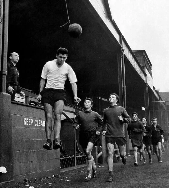 Welsh footballer Mel Nurse goes up for the ball during heading practice