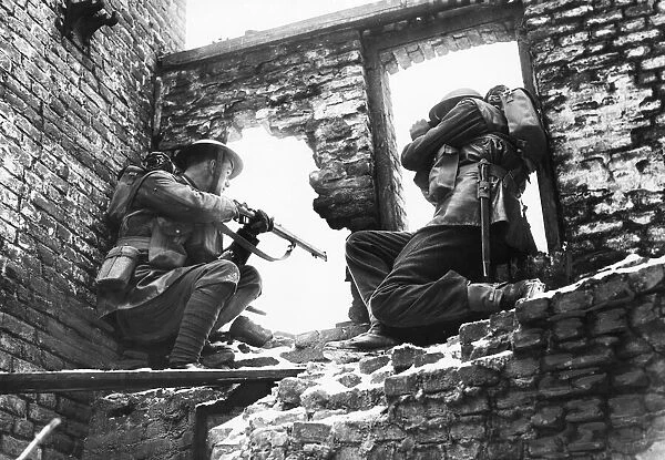 Welsh Guards in a ruined building during a training exercise. 26th February 1940