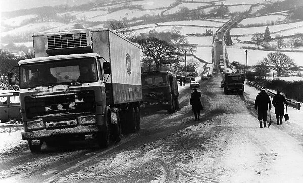 Welsh Weather 1979, Our picture shows... a long line of lorries queue to make the long