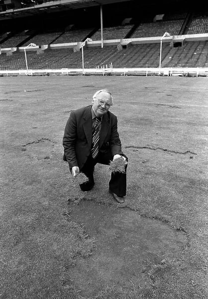 Wembley groundsman Don Gallacher inspects the damage cause by the Scottish fans following