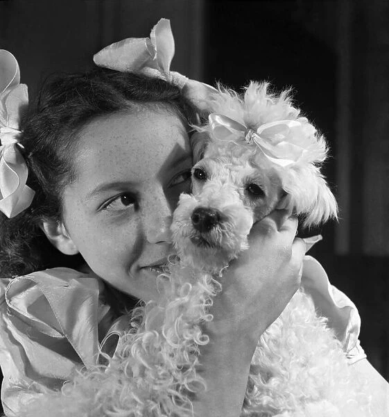 Wendy Jackson with a Poodle. April 1952 C1574-001