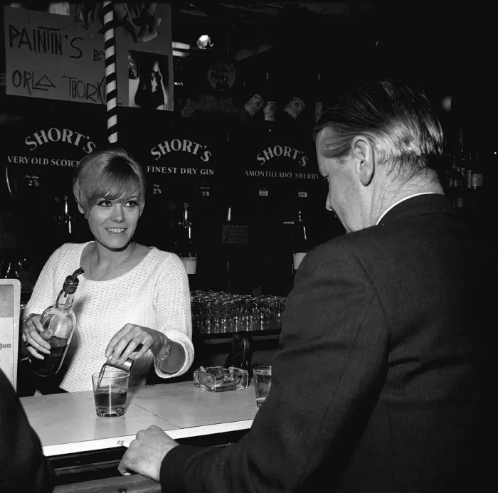 Framed Print : Wendy Richard May 1966 Actress Model aged 19 years old serving behind bar near Framed Print : Wendy Richard May 1966 Actress Model aged 19 years old serving behind bar near