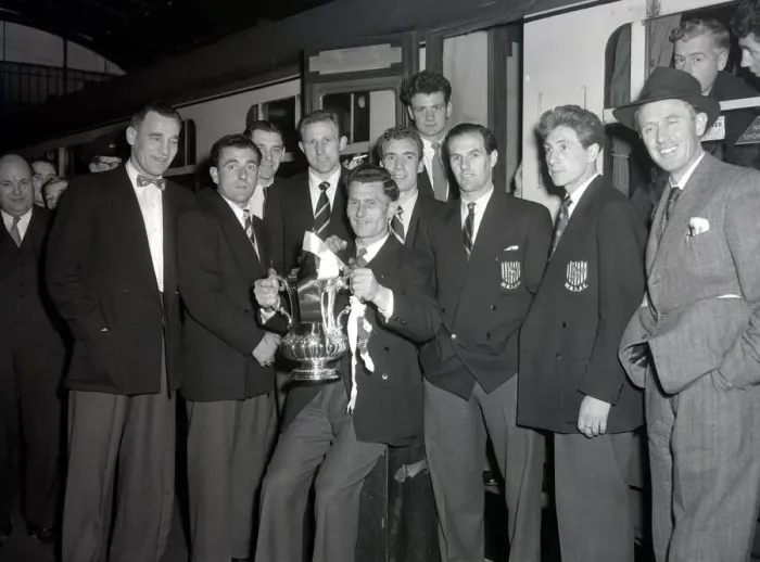 Framed Print : West Bromwich Albion Players with the FA Cup trophy prior to boarding the train as they