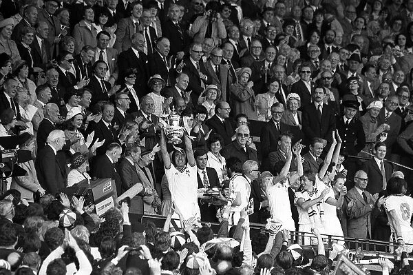 West Ham Captain Billy Bonds holds up the FA Cup after the Presentation Hammers had