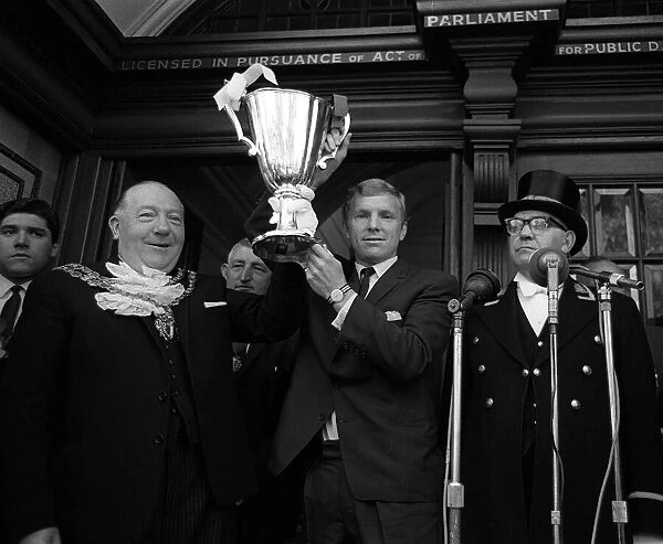 West Ham Captian Bobby Moore shows the European Cup Winners Cup trophy to the crowds