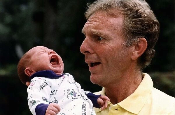 Former West Ham and England footballer Bobby Moore with his first grandchild Poppy