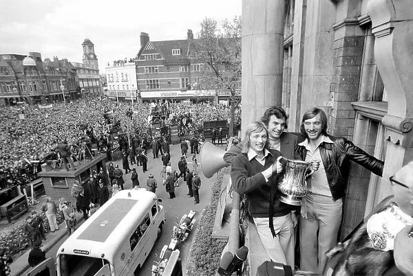 West Ham players Alan Taylor, Trevor Brooking and captain Billy Bonds show off the trophy
