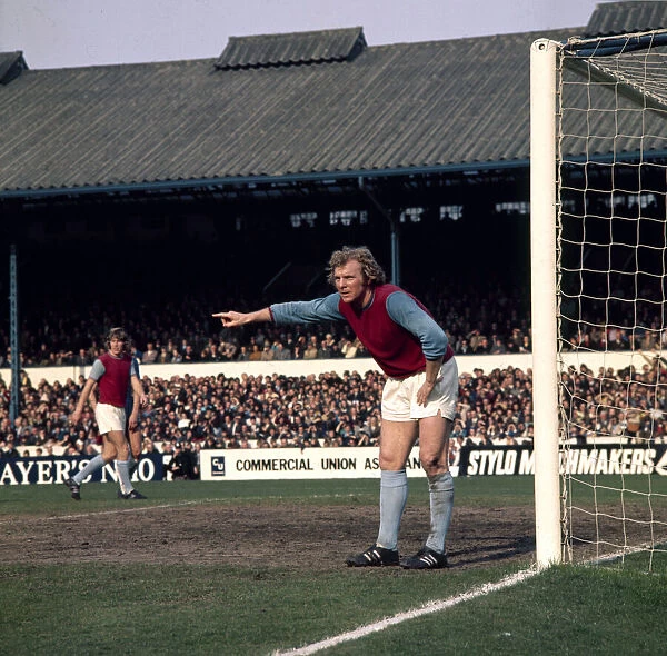 West Ham United footballer Bobby Moore shouts instructions to teammates during the league