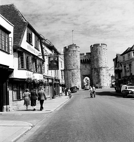 Westgate towers and Falstaff Inn, in Canterbury Kent. October 1952 C4984-001
