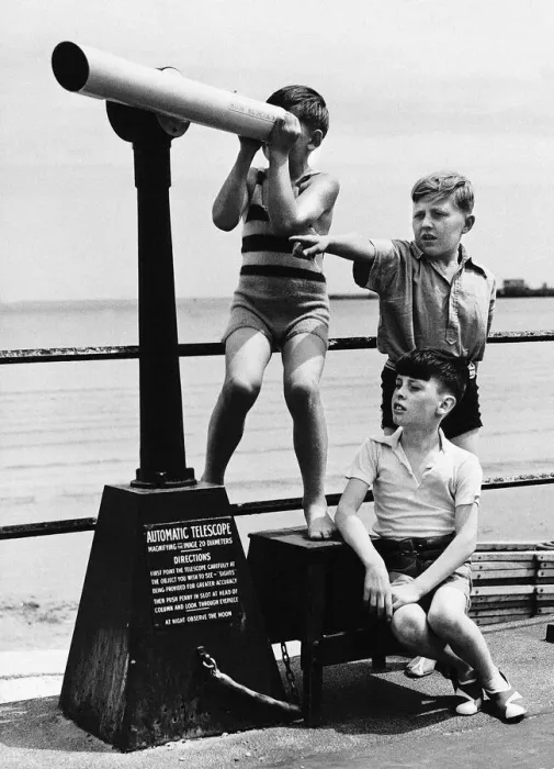 Framed Print : Weymouth boys play on coast with telescope in the Dorset seaside town Framed Print : Weymouth boys play on coast with telescope in the Dorset seaside town