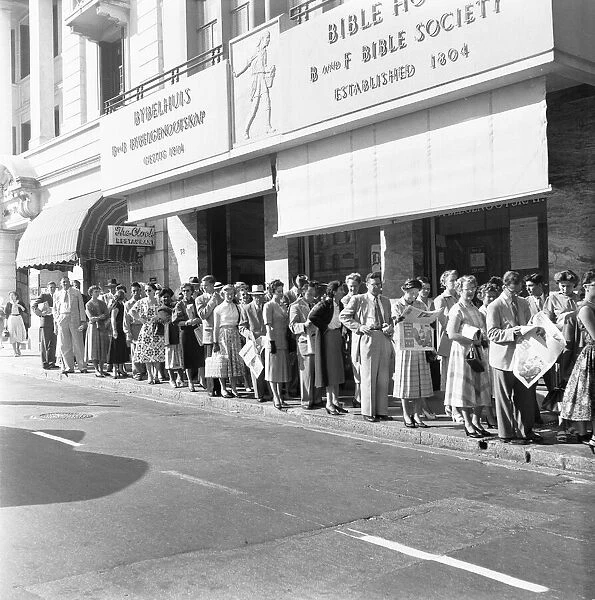 Whites only queue for a bus in Cape Town. 4th February 1955