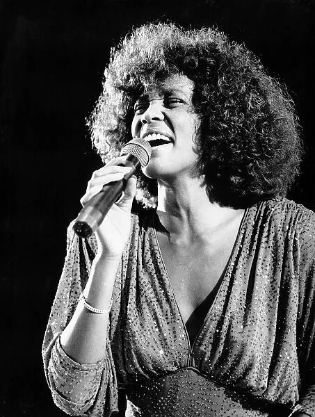 Whitney Houston performing at a concert October 1987