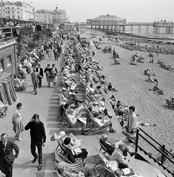 Whitsunday holiday scenes, with the pier in the background, in Eastbourne, Sussex