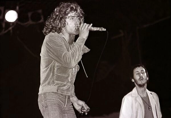 The Who in Concert - May 1976 Roger Daltrey on stage singing at the Charlton