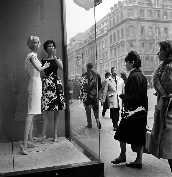 Whos the dummy? Window shopping in Oxford Street, London. 1960