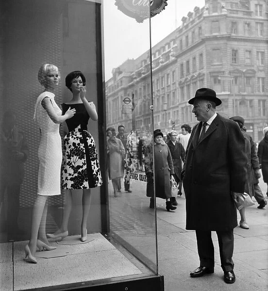 Whos the dummy? Window shopping in Oxford Street, London. Circa 1960