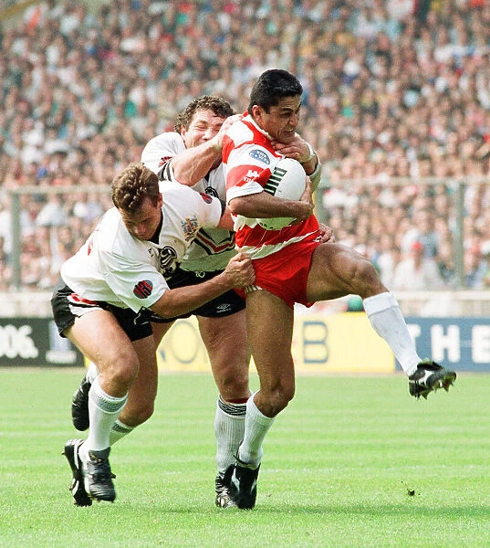 Widnes defence tries to close down the Wigan attack during the Rugby League Cup Final at