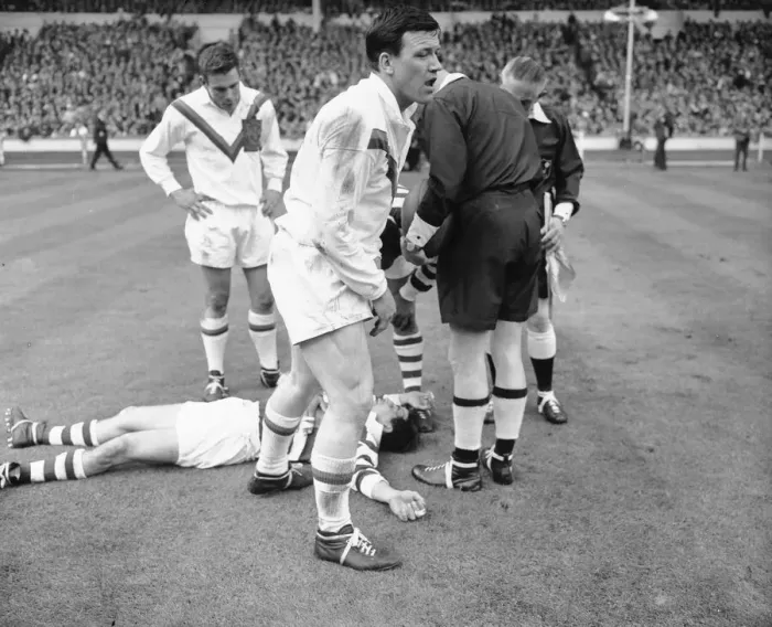 Framed Print : Wigan full back Bolton lies on the ground concussed after the half time whistle had blown Framed Print : Wigan full back Bolton lies on the ground concussed after the half time whistle had blown