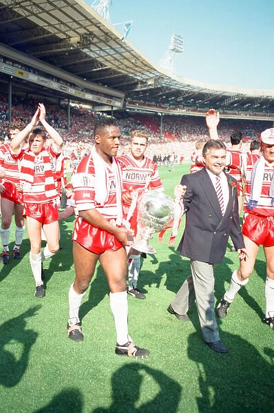 Wigan complete a lap of honour with the Rugby League Cup following their 36 -14 victory