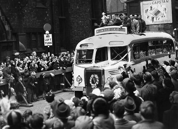 Wigan return home with the Rugby League Cup. The team finish their triumphal tour of
