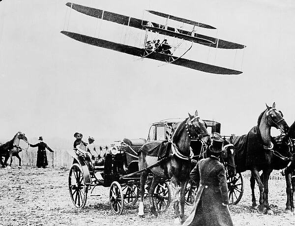 Wilbur Wright in flight at Le Mans, 1909. The Wright Brothers staged a