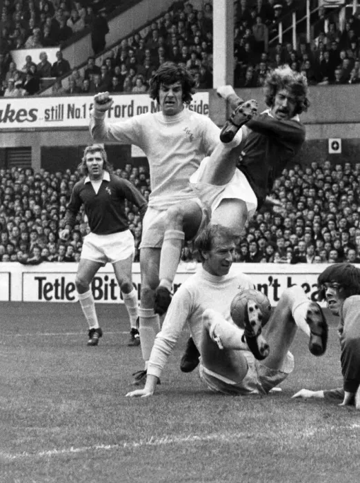 Framed Print : A wild swing from Evertons John Connolly when challenged by Joe Jordan Framed Print : A wild swing from Evertons John Connolly when challenged by Joe Jordan
