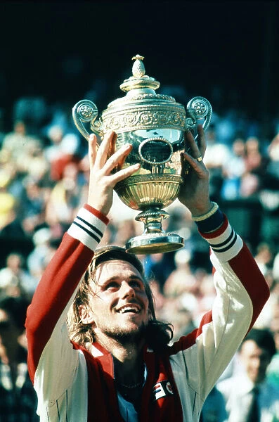 Wimbledon 1977. Bjorn Borg holds up the trophy after winning the men