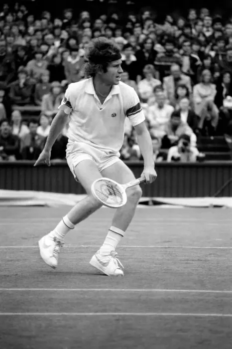 Framed Print : Wimbledon 6th Day: McEnroe v. Stan Smith. Centre Court - McEnroe in action today