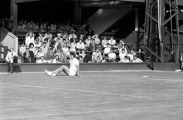Wimbledon Tennis Championships 1970 1st Day. Roger Taylor finishes on the floor after
