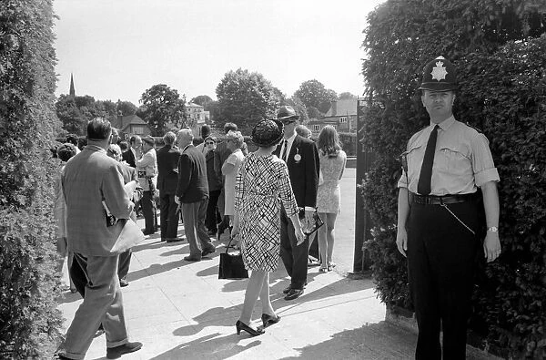 Wimbledon Tennis Championships 1970 1st Day. A policeman stands in the shadow at