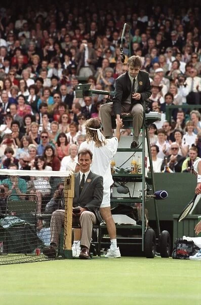 Wimbledon Tennis Championships. Andre Agassi shakes hands with the umpire