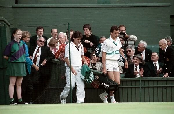 Wimbledon Tennis Championships. Ivan Lendl and Kelly Evernden walk out on court